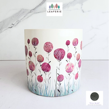 Load image into Gallery viewer, Cylindrical container with pink floral design on a white background, featuring the Leaferie brand.