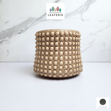 Load image into Gallery viewer, The Leaferie Bronwyn studded beige flowerpot. ceramic material