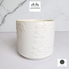 Load image into Gallery viewer, The Leaferie reidun white ceramic pot with flower motif.