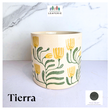Load image into Gallery viewer, Tierra Decorative pot with floral design on a marble background, featuring the brand 'LEAFERIE'.