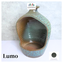 Load image into Gallery viewer, Lumo Ceramic vase with textured surface and 'LEAFERIE' branding on a light gray background
