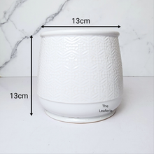 Load image into Gallery viewer, The Leaferie Nordman white ceramic pot with small imprinted design.