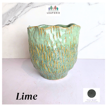Load image into Gallery viewer, Lime Green ceramic vase with gold accents on a white background, featuring the Leaferie brand.