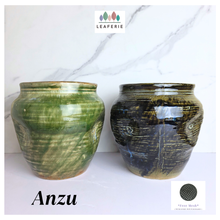 Load image into Gallery viewer, Anzu Leaferie ceramic flowerpot with green and black glaze on a white background, featuring the brand 'LEAFERIE'.