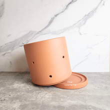 Load image into Gallery viewer, The Leaferie terracotta E Pot with holes. comes in 2 sizes