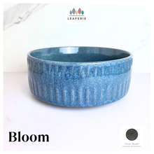 Load image into Gallery viewer, Bloom Blue ceramic bowl with textured surface on a white background, featuring the LEAFAERIE brand.