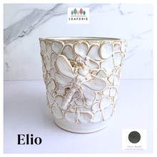 Load image into Gallery viewer, Handmade Elio Decorative ceramic pot with dragonfly design on a marble background, featuring the brand 'LEAFERIE'.