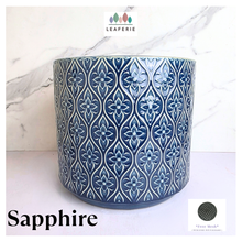 Load image into Gallery viewer, Sapphire Blue patterned candle container with 'LEAFAERIE' branding on a marble background