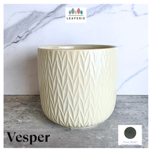 Load image into Gallery viewer, Vesper Beige ceramic pot with geometric pattern on a marble surface, featuring the LEAFAERIE brand.