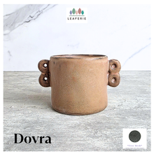 Load image into Gallery viewer, Dovra Brown ceramic planter with handles on a light gray surface, branded 'LEAFERIE'.