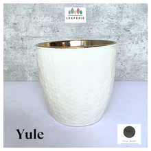 Load image into Gallery viewer, Yule snowflakes White textured planter with gold interior on a light gray background, featuring the Leaferie brand.