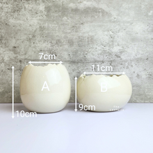 Load image into Gallery viewer, The Leaferie Maja Egg flowerpot. cream white ceramic pot. front view of designs and size