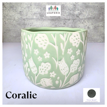 Load image into Gallery viewer, Coralie Green ceramic planter with white floral patterns on a gray background, featuring the brand 'LEAFERIE'.