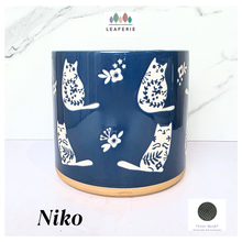 Load image into Gallery viewer, Niko cat Navy blue mug with white cat designs on a white background, featuring the brand 'LEAFERIE'.
