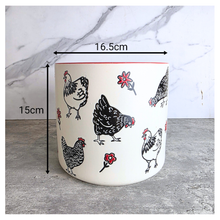 Load image into Gallery viewer, Nilo Ceramic pot with chicken design on a marble background, featuring the brand 'LEAFERIE'.