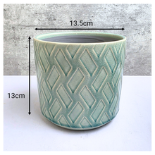 Load image into Gallery viewer, Rosso Green ceramic pot with geometric pattern on a light gray background, featuring the Leaferie brand.