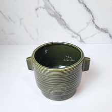 Load image into Gallery viewer, The Leaferie Aizen plant pot. 3 colours, red , green and white. ceramic pots. top view of green colour