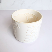 Load image into Gallery viewer, The Leaferie reidun white ceramic pot with flower motif.