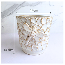 Load image into Gallery viewer, Handmade Elio Decorative ceramic pot with dragonfly design on a marble background, featuring the brand 'LEAFERIE'.