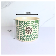 Load image into Gallery viewer, Petrax Ceramic pot with green floral pattern on a light background, featuring the Leaferie brand.
