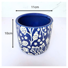 Load image into Gallery viewer, Marina Blue ceramic pot with white floral patterns on a white background, featuring the brand 'LEAFERIE'.