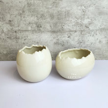 Load image into Gallery viewer, The Leaferie Maja Egg flowerpot. cream white ceramic pot. front view of designs