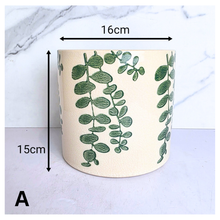 Load image into Gallery viewer, Verdin Two ceramic planters with green leaf patterns on a light blue background, featuring the brand 'LEAFERIE'.