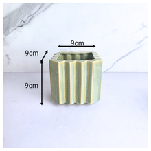 Load image into Gallery viewer, Rosin square ceramic planters with striped design on a marble surface, featuring the brand 'LEAFERIE'.