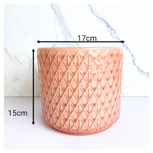 Load image into Gallery viewer, Petalia Decorative pink pot with geometric pattern on a marble background, featuring the brand
