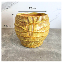 Load image into Gallery viewer, Prairie Gold textured planter on a gray surface with 'LEAFERIE'