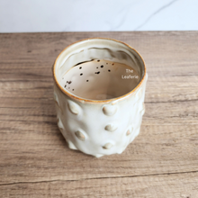 Load image into Gallery viewer, The Leaferie Elpida beige flowerpot with studs. ceramic material