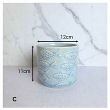 Load image into Gallery viewer, Lumera with fish pattern flowerpot on a white background, featuring the brand 'LEAFERIE'.