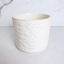 Load image into Gallery viewer, The Leaferie reidun white ceramic pot with flower motif.