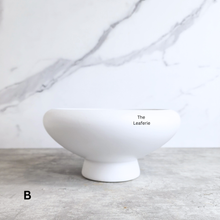 Load image into Gallery viewer, Xara ceramic flowerpot in white, black, and green with Leaferie branding.