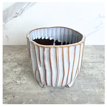 Load image into Gallery viewer, Jace Ceramic planter with striped design on a marble surface, featuring the brand 'LEAFERIE'.
