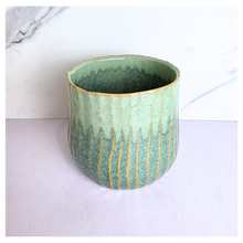 Load image into Gallery viewer, Pistachio Leaferie Green ceramic planter with gold accents on a white background, featuring the Leaferie brand