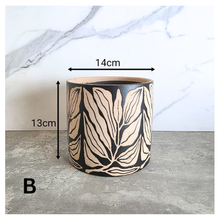 Load image into Gallery viewer, Verdelle Two ceramic pots with leaf pattern on a gray surface, branded 'LEAFTERIE'.