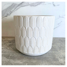 Load image into Gallery viewer, Finn White ceramic planter with geometric pattern on a marble surface, featuring the Leaferie brand.