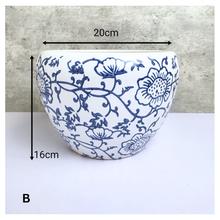 Load image into Gallery viewer, Aveline Ceramic planter with blue floral pattern on a gray background, featuring the Leaferie brand.