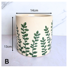 Load image into Gallery viewer, Verdin Two ceramic planters with green leaf patterns on a light blue background, featuring the brand 'LEAFERIE'.