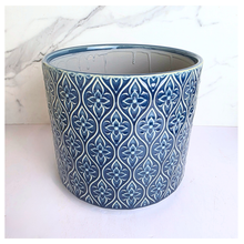 Load image into Gallery viewer, Sapphire Blue patterned candle container with 'LEAFAERIE' branding on a marble background