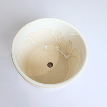 Load image into Gallery viewer, The Leaferie reidun white ceramic pot with flower motif.