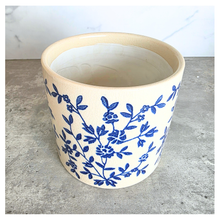 Load image into Gallery viewer, Caelis Ceramic planter with blue floral pattern on a marble surface, featuring the brand 'LEAFAERIE'.