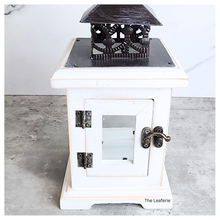 Load image into Gallery viewer, Luma White lantern with black metal top on a gray surface, brand 'The Leaferie' visible.