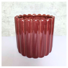 Load image into Gallery viewer, Rubi Red ceramic vase with ribbed texture on a light gray background, featuring the brand 'LEAFERIE'.