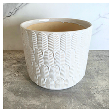 Load image into Gallery viewer, Finn White ceramic planter with geometric pattern on a marble surface, featuring the Leaferie brand.