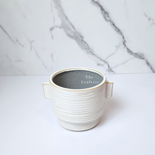 Load image into Gallery viewer, The Leaferie Aizen plant pot. 3 colours, red , green and white. ceramic pots. top view of white colour