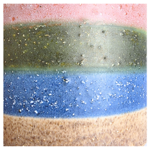 Load image into Gallery viewer, Tetra Ceramic cup with multicolored stripes on a light background, featuring the brand 'LEAFAERIE'.