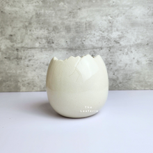 Load image into Gallery viewer, The Leaferie Maja Egg flowerpot. cream white ceramic pot. front view of designs A