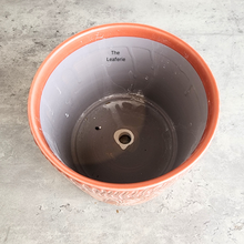 Load image into Gallery viewer, The Leaferie Roselle red / orange ceramic pot with leaf imprint.